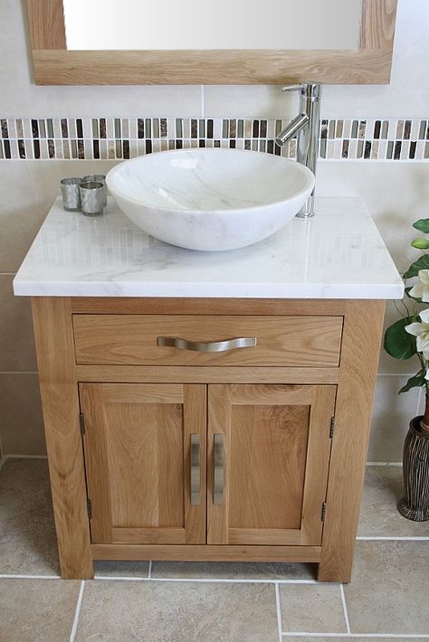 Delivery: 2-3 Working Days Next Day Delivery : Upgrade available upon checkout. This unit comes complete with: A beautiful marble bowl set. A stunning pre drilled white veined marble top. Bowl dimensions : H14cm X Diameter 43cm. This complete bathroom vanity unit has … Continue reading → Bathroom Sink Units, Veined Marble, Oak Bathroom Vanity, Bathroom Vanity Unit, Oak Bathroom, Bathroom Sink Taps, Marble Bowl, Downstairs Bathroom, Bathroom Vanity Units