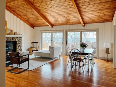 Main living area of cabin painted Benjamin Moore Swiss Coffee and Farrow & Ball Shaded White trim. Cabin Wall Colors, Farrow Ball Shaded White, Knotty Pine Living Room, Painted Pine Walls, Cabin Update, Cabin Paint Colors, Benjamin Moore Swiss Coffee, Knotty Pine Walls, Log Home Interior