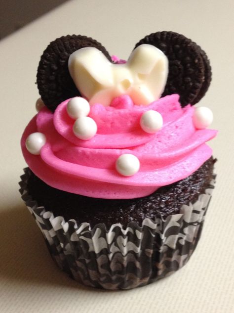 Minnie Mouse cupcakes made for a little girl's second birthday. Chocolate and vanilla cake, butter cream icing colored pink, edible pearls, mini-Oreo ears, and a white chocolate (molded) bow! The cutest! Chocolate And Vanilla Cake, Minnie Mouse Cupcakes, Edible Pearls, Icing Colors, Cowgirl Birthday, Chocolate Molds, Vanilla Cake, 2nd Birthday, Oreo