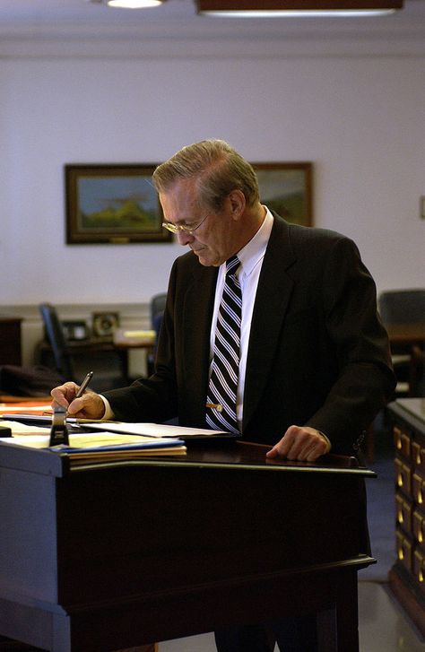 Former U.S. Secretary of Defense Donald Rumsfeld works at the stand-up desk in his office on Oct. 30, 2003.  (Photo credit: Wikipedia) Eco Friendly Furniture, Stand Up Desk, His Office, Adjustable Standing Desk, Medical News, Study Space, A Desk, Study Motivation, Stay Fit