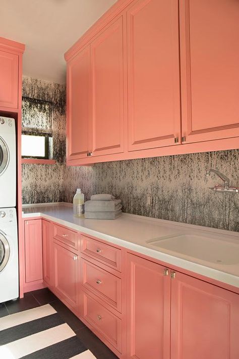 Chic laundry room features coral pink cabinets paired with white ocuntertops and… Coral Room Ideas, Chic Laundry Room, Coral Kitchen, Laundry Room Counter, Coral Room, Pink Laundry Rooms, Pink Cabinets, Pink Diy, Room Storage Diy