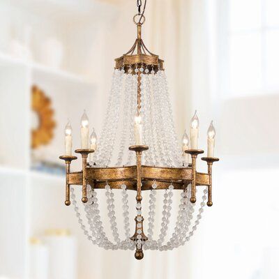 This 8-light empire chandelier is a shimmering centerpiece for your entryway or dining room. The frame is made from metal with a galvanized gold finish, and it's draped with strands of chic white beads that bring an elegant feel to your space. A central band of evenly spaced candelabra bulb bases holds 8, 40W candle-style bulbs (sold separately) - emitting ambient light that reflects beautifully off the surrounding clear beads. Ideal for any glam or French country home, install this chandelier w Basket Chandelier, Hallway Light, Candelabra Chandeliers, Chandelier Metal, Empire Chandelier, Candle Style Chandelier, Candle Chandelier, Gold Candles, Beaded Chandelier