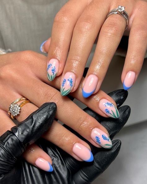 30 Best Early Spring Nails to Try Nails Almond Spring, Blue Spring Nail Ideas, Soring Nails, Floral Acrylic Nails, Blue Flower Gel Nails, Blue Floral Almond Nails, Blue Tips With Flowers Nails, Early Spring Nails, Pink Nails Blue Flowers