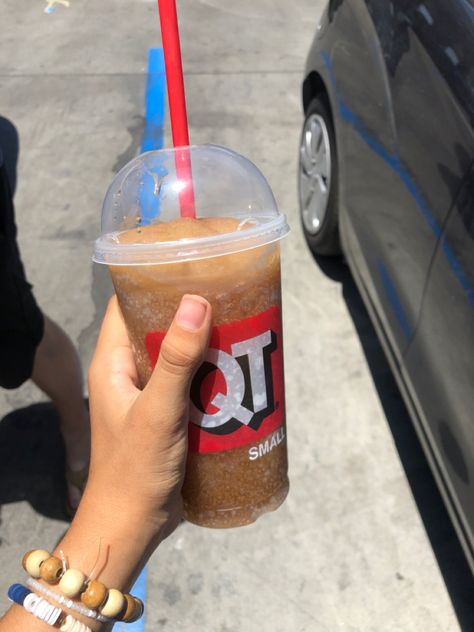 A person holding a Qt coke slushy Coke Slushie, Secrets Aesthetic, Cocoa Cola, Jeremiah Fisher, Aesthetic Board, Starbucks Drinks, Slushies, Summer 2024, Dark Aesthetic