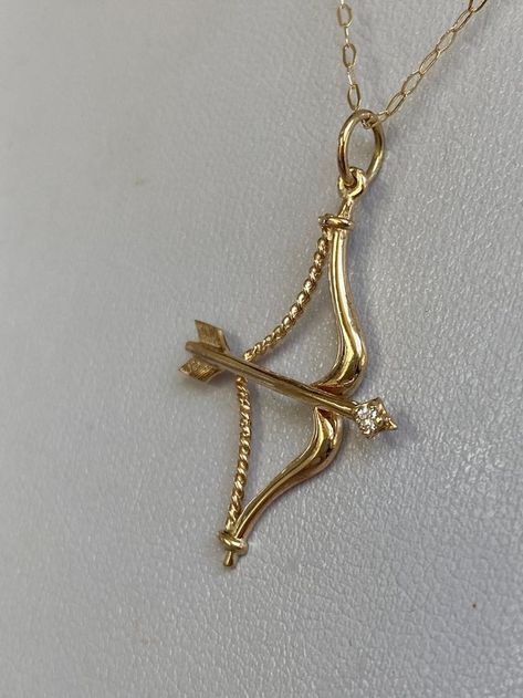 Bow And Arrow Pendant, Bow And Arrow Jewelry, Bow And Arrow Necklace, Gold Bow And Arrow, Astrology Sagittarius, Arrow Pendant Necklace, Sagittarius Necklace, Symbolic Meanings, Arrow Jewelry