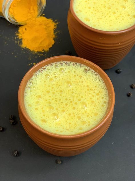 Turmeric milk also known as golden milk aka Haldi Doodh is a healthy Indian drink recipe that has been gaining popularity in the West.It is prepared with milk, turmeric, black pepper and lightly sweetened with honey.This Haldi Doodh recipe is an ancient healing remedy commonly used in India to treat fever ,colds ,cough and boost your immunity. Turmeric Milk Benefits, Turmeric Milk Recipe, Haldi Doodh, Turmeric Golden Milk, Golden Milk Recipe, Milk Benefits, Immune Boosting Foods, Turmeric Milk, Turmeric Health Benefits