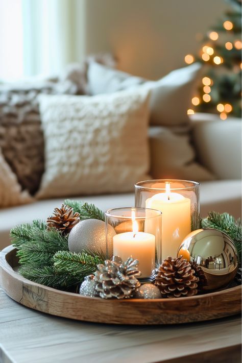 How can something so simple look so festive? I started with a wooden tray, added pine cones, twigs, and candles, and the result was a cozy, rustic Christmas centerpiece. It’s so easy to mix and match for a warm, inviting coffee table. Give this simple idea a try—it’s perfect for winter decorating! Sofa End Tables Styling, Tray With Candles Decor, Dining Table Winter Decor, Styling A Tiered Tray, Winter Table Centerpieces Diy, Winter Coffee Table Decor Ideas, Couch Tray Decor, Under Coffee Table Decor, Christmas To Winter Decor Transition