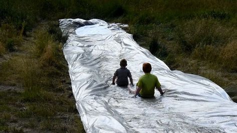 Don't let summer slip away without doing something fun. Make yourself and easy DIY giant slip and slide. Keep the kids entertained and outdoors making memories with this tutorial. Fun for kids and adults too! Check out the video tutorial. We p a hillside on our property to use for this diy slip and slide project. You do not need to have a hillside to do this project. A slope, however, will allow you to make a longer faster slip and slide. You absolutely do not have to dig out a p… Giant Slip And Slide, Outdoor Jenga, Play Cottage, Ninja Warrior Course, Outdoor Movie Screen, Diy Lawn, Sloped Backyard, Pottery Barn Inspired, Sloped Garden