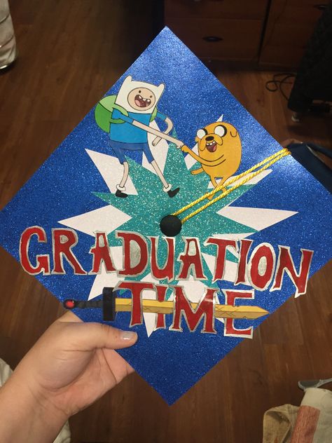 Adventure Time Graduation Cap! Gown Decoration Graduation, Graduation Cap Designs Adventure Time, Graduation Cap Adventure Time, Smashing Pumpkins Grad Cap, Back To The Future Graduation Cap, Grap Cap Ideas, Adventure Time Grad Cap, Graphic Design Grad Cap, Grad Cap Painting Ideas