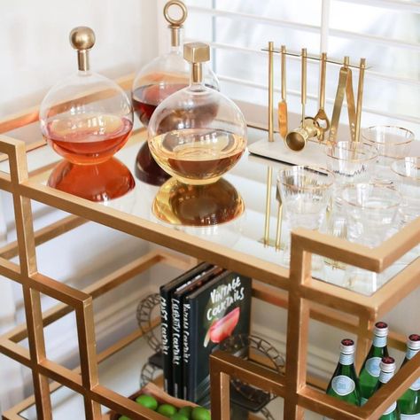 15 brilliant bar cart styling tricks Decanter Display Bar Cart, Bar Cart Display Ideas, 21st Birthday Bar Cart, Bar Tools Display Ideas, Bar Cart Inspo Modern, Decanter Display Bar, Large Bar Cart, Glam Bar Cart, Bar Cart Aesthetic