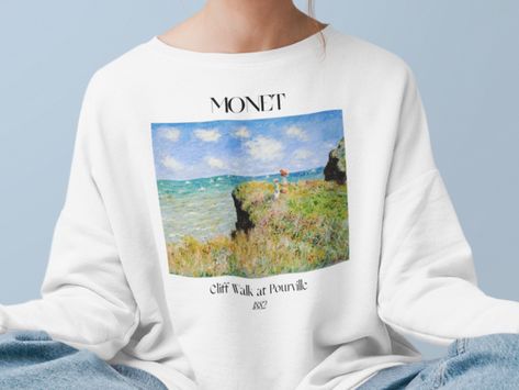 Claude Monet Cliff Walk at Pourville Sweatshirt Famous Painter Shirt French Impressionism Classical Artsy Aesthetic Vintage Indie Clothing * DESIGN: Hand printed using DTG (Direct To Garment) method with certified pigment inks (Innobella Textile Inks) - high durability and washability as the ink has scored 4.0 or higher on the AATCC wash test Features air jet yarn for a softer feel and reduced piling and the collar is ribbed knit, so it retains its shape even after washing Knit in one piece usin Monet Poppy Field, Artsy Aesthetic, Poppy Field, Aesthetic Vintage, Vintage Shirt, Claude Monet, Impressionism, Painter, Design