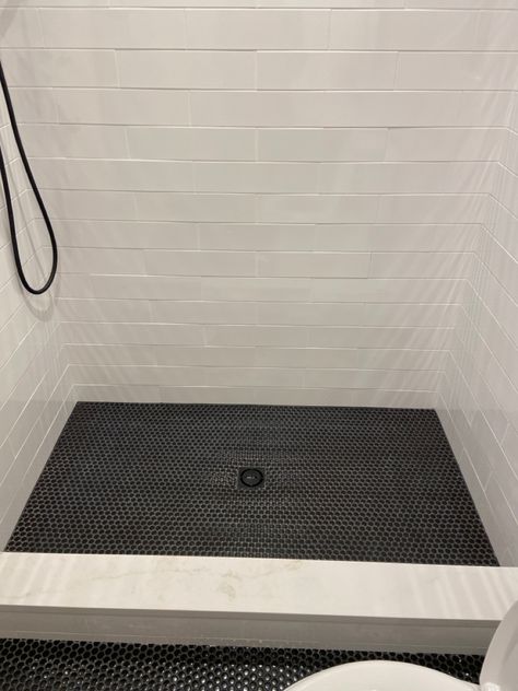 Black Penny Round Shower Floor, Shower Floor Penny Tile, Black Penny Tile Shower Floor, Tile Baseboard Bathroom, Large Subway Tile Shower White, Penny Round Tile Floor, Penny Round Tile, River Bath, Restroom Ideas