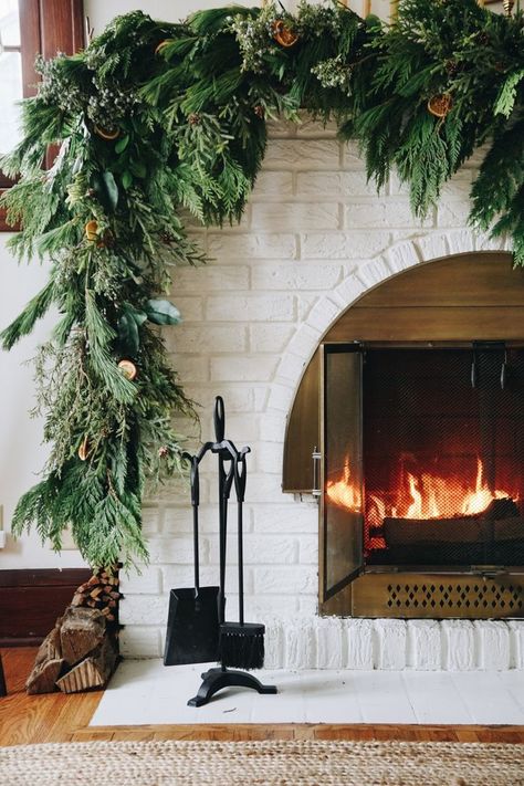 Asymmetrical garland: an unexpected take on traditional Holiday fireplace mantel decor. Hear my thought process and how to create the look at your house. Asymmetrical Garland On Mantle, Asymmetrical Garland Mantle, Diy Fresh Garland, Christmas Mantel Decorations Diy, Asymmetrical Garland, Garland Diy Christmas, Diy Christmas Fireplace, Christmas Fireplace Mantels, Holiday Fireplace