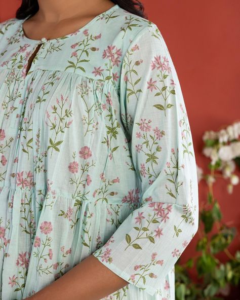 Summer 2024 - New Arrivals! Are you all about that ‘fairytale core’ aesthetic? The easy elegance of our Botanical Tiered Dress flatters everybody! The soft pastels and dreamy floral print infuse this timeless dress with a modest grace. [ Cottons Jaipur, Cotton, Floral, Botanical floral, Handmade Kurtas, Everyday-wear, Summer staples ] #cottons #cottonsjaipur #newarrivals #floral #summer #summer2024 #handcraftedkurtas #comfortfits #cottonsuitset #summertime #summerstaples #botanical #summe... Simple Kurti Designs, Timeless Dress, + Core + Aesthetic, Summer Staples, Indian Fashion Dresses, Stylish Dress Designs, Tiered Dress, Kurti Designs, Pakistani Dresses