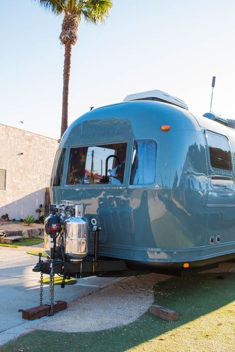 Airstream Guest House, Painted Airstream Exterior, Painted Airstream, Vintage Camper Renovation, Airstream Caravel, Farm Style Sink, Airstream Decor, Custom Mercedes Benz, Vintage Motorhome