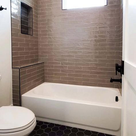 🖤 Modern and minimal with a touch of warmth! This sleek bathroom design features matte black hexagonal tile flooring, light wood cabinetry, and a chic brick-tiled shower wall, creating a clean and contemporary look. Perfect for those who love simplicity with a hint of style. 🚿✨ Flooring supplied and installed by: @owsiflooringanddesign #OWSIUSA #BathroomDesign #ModernMinimalism #HexTile #HomeInspiration #interiordesign Flooring Light Wood, Sleek Bathroom Design, Flooring Light, Sleek Bathroom, Hex Tile, Tiled Shower, Hexagon Tiles, Tile Flooring, Light Wood