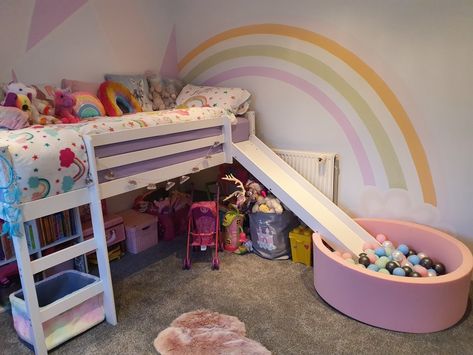 Girls rainbow dream room. Art deco painted wall. Rainbows and unicorns. Mid sleeper bed with slide and ball pit. Bunk Bed With Slide And Ball Pit, Bed With Slide For Girls Fun, Loft Bed Ideas With Slide, Mid Sleeper Girls Room, Unicorn Rainbow Room Ideas, Unicorn Bunk Bed, Mid Sleeper Bed Ideas, Girls Bedroom Ideas Bunk Beds, Girls Bedroom Ideas Rainbow