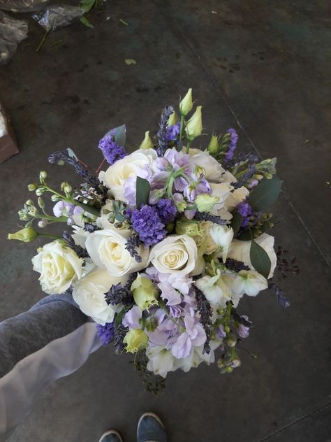 White and purple bridal bouquet using roses, carnations, stock, statice, dried lavender, lisianthus, and seeded eucalyptus. Made at Oberer's Flowers in Cincinnati. Lavender Lisianthus Bouquet, Purple Lisianthus Bouquet, Purple Carnation Bouquet, Lisianthus Wedding Bouquet, Lavender Lisianthus, Lisianthus Bouquet, Mum Bouquet, Dried Flower Bouquet Wedding, Purple Lisianthus