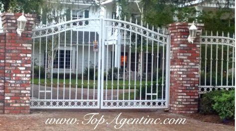 White wrought iron gate with rough brick pillars Rod Iron Gate, Brick Pillars, Rod Iron, Wrought Iron Gate, Wrought Iron Fences, Wrought Iron Gates, Front Gates, California Real Estate, Iron Fence