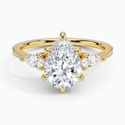 Pear Shaped Opera Accented Three Stone Diamond Engagement Ring - 18K Yellow Gold. Captivating pear-shaped diamonds brilliantly frame the center gem in this classic three stone ring. The petite diamond-adorned band gently tapers for a sleek, romantic finish (1/2 total carat weight). Pear Cut Diamond Engagement Ring, Pear Diamond Engagement Ring, Three Stone Diamond Rings Engagement, Pave Diamond Engagement Rings, Chic Rings, Three Stone Diamond Ring, Lab Diamond Engagement Ring, Rose Gold Diamond Ring, Pear Cut Diamond