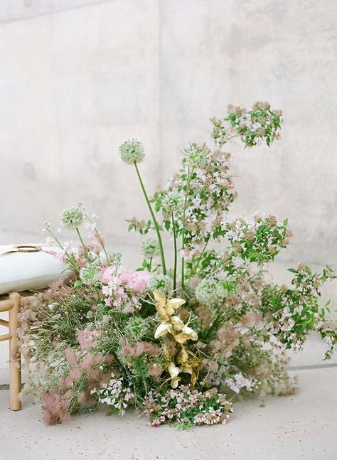 These lush floral arrangements were peppered with gilded butterflies, set aside wooden benches, set along the Algae Wall at Amagiri. Featured in Brides. Event Design & Planning by HauteFêtes Photography by KT Merry | Floral Design by Sarah Winward | Amangiri | Utah Wedding Recessional Songs, Desert Drawing, Amangiri Resort, Wildflower Wedding Theme, Blush Bouquet Wedding, Kt Merry, Aisle Flowers, Blush Wedding Flowers, Flower Installation