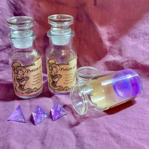 I found some extra stock of my pastel potion dice rollers so purple is back in stock now! FEHUSTUDIO.com (not Etsy). #dice #handmadedice #resindice #resindiceset #potion #healthpotion #diceroller #dungeonsanddragons #dnd #dnddice #diceforsale Dice Roller, Healing Potion, Back In Stock, Dungeons And Dragons, Perfume Bottles, Healing, Pastel, Purple, Art