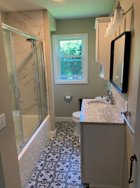 This bathroom features Waypoint cabinetry and a Cambria Berwyn Quartz vanity top. It also includes Kohler and Symmons plumbing supplies in White and Chrome finishes with a Sand Baroque Deco porcelain floor tile to complete the space. Cambria Berwyn, Quartz Vanity, Quartz Vanity Tops, Bathroom Projects, Bathroom Features, Kitchen Bathroom Remodel, Providence Ri, Porcelain Floor, Bathroom Redo