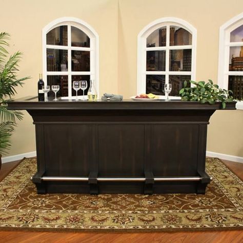 This dark brown home bar cabinet is larger than most assembly style units. Built with hardwood, it's a sturdy unit that includes a foot-rest bar on the bottom making it a terrific unit for placing bar stools along the front. Kitchen Bench Nook, Basement Pub Ideas, Basement Sunroom, Sunroom Bar, Bench Nook, Extra Room Ideas, Free Standing Bar, Basement Pub, Mini Bar At Home