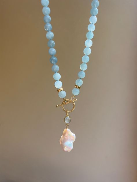 This elegant eye-catching beaded necklace is made of natural aquamarines (AAA quality) and embellished with beautiful baroque pearl pendant settled on an aquamarine charm and gold vermeil toggle clasp. It will become a wonderful gift idea, especially for those who are born in March, as aquamarine is the birthstone for March.  MATERIAL Aquamarine, gold vermeil, freshwater pearl  SPECIFICATIONS Length 46 cm (18 inches) Beads are 8 mm Handmade in Spain Necklace comes in a gift box Worldwide shipmen Gold Vermeil Jewelry, Toggle Necklace, Gemstone Necklaces, Baroque Pearl Necklace, Aquamarine Jewelry, Vermeil Jewelry, Beaded Choker Necklace, Pearl Charms, Necklaces For Women