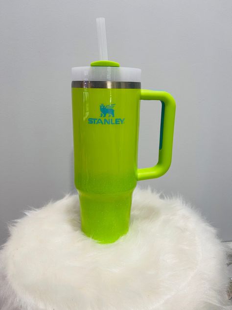 30OZ Stanley Tumbler Bright Lime With Green Glitter Ombre  *Each tumbler comes with a lid and straw. The Tumbler's can hold both hot and cold liquids. *This tumbler can be customized with a decal (name) or you can purchase without. If you would like it customized please leave comments in the message section. Please note if you do want decal on cup it will take longer to arrive to you due to making the decal and epoxy dry time. *Each Tumbler is handmade, no two cups are alike. Please note, due to the tumblers being handmade, the colors and designs might vary slightly from the photos. FDA compliant-Food Safe epoxy. *Due to the product and work that each tumbler takes they are not refundable or able to be returned. If you have an issue with the tumbler please contact me, and we will resolve t Green Tumblers Ideas, Neon Green Stanley Cup, Green Glitter Tumbler Ideas, Green Glitter Tumbler, Lime Green Tumbler, Food Safe Epoxy, Thermos Bottle, Glitter Ombre, Stanley Cup