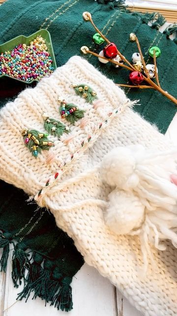 Laine Irene on Instagram: "Stockings were always my favorite thing about Christmas morning growing up 🥰 I stitched up this sweet stocking for my daughter this year and added all kinds of Christmas beads, bells and stars to it! Then added in a pretty red and green yarn and did a whipped back stitch with TINSEL yarn 🤩 So cozy for the holidays! Stocking is from @joann_stores and is perfect for adding your own touch to! . . . #stocking #christmastime #fiberart #handmadewithjoann #cozyvibes #merryandbright" Beaded Christmas Stocking, Whipped Back Stitch, Christmas Beads, Green Yarn, Christmas Bead, Holiday Magic, About Christmas, Handmade Holiday, Back Stitch