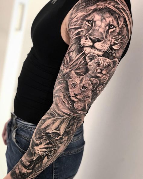 Lion with cubs & tiger sleeve by Dario Castillo, an artist at La Manuela Tattoo in Madrid, Spain. Family Sleeve Tattoo, Lion Shoulder Tattoo, Voll Arm-tattoos, Tato Lengan Bawah, Family Tattoos For Men, Tiger Tattoo Sleeve, Cubs Tattoo, Tato Dada, Animal Sleeve Tattoo