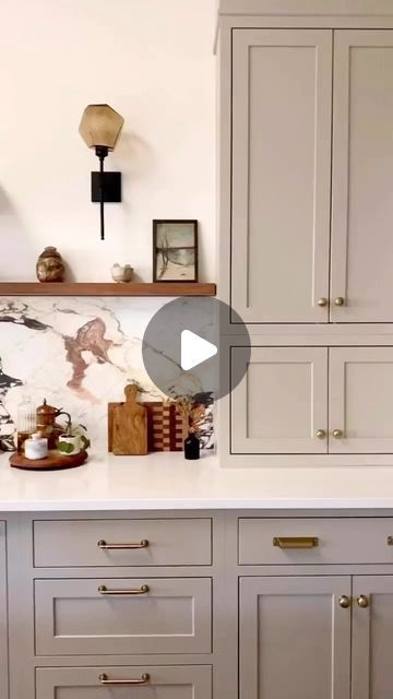 Virtual Interior Design • Setting For Four Interiors on Instagram: "Crushing on this ‘it’ mushroom cabinet color! Love this soft earthy hue paired with the gorgeous stone slab backsplash and brass hardware! Isn’t this color gorgeous?!
@kristinlaingdesign 

💫 Follow @settingforfour  for more interior inspiration and design ideas 💫
.
.
.
. 
#kitchen #kitchendesign #kitcheninspo #kitchendesignideas #kitchenisland
#kitchenremodel  #kitchencabinets 
#howwedwell #homeimprovements #CurrentDesignSituation #interiorlovers #interior_and_living #FindItStyleIt #lightandbright #InMyDomaine #MyDomaine #SMMakeLifeBeautiful #bhghome #homesohard #hgtv #amberinteriorsaintgotnothinonme" Mushroom Cabinet Color, Mushroom Cabinets Kitchens, Mushroom Cabinets, Slab Backsplash, Cabinet Color, Cabinet Colors, Ideas Kitchen, Brass Hardware, Interior Inspiration