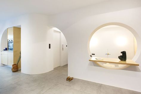 sculptural partition wall with curved openings organizes apartment interior in athens, greece Curved Partition Wall, Curved Walls Interior, Curved Partition, Small Attic Apartment, Curved Bar Design, Terracotta House, Athens Apartment, Creative Studio Space, Fold Out Beds