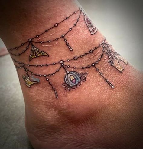 3d Bracelet Tattoo, Tattoo Charm Bracelet Wrist, Lace Anklet Tattoo, Anklet Charm Tattoos For Women, Disney Anklet Tattoos For Women, Anklet Tattoo With Charms, Family Charm Bracelet Tattoo, Disney Ankle Bracelet Tattoo, Disney Bracelet Tattoo