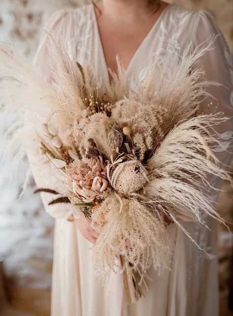 A huge statement bouquet full of fluffy pampas and exotic dried flowers. We used a warm neutral colour palette and kept the look very natural. To see more dried wedding flower inspo please visit my website. Designed and created by @bryonymaeflowers Photography @juliehermannphotography Bouquet With Dried Flowers, Flower Bride Bouquet, Dried Flower Wedding, Flower Bride, Grass Bouquet, Pampas Grass Bouquet, Boho Wedding Bouquet, Wedding Bridal Bouquets, Bride Bouquets