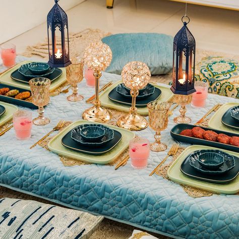 Shop the look for a feast-ive celebration! 😍🍽️ Add a touch of magic to your moments of togetherness with our exquisite range. 🪄✨ Products included: 1. Luxe Moroccan 28-Piece Ceramic Dinnerware For 6 Dark Green 2. Set Of 6 Floral Drinking Glass Tumblers 3. Luxurious Crystal Votive Candle Holder Stand Set Of 2 4. Navy Blue Moroccan Candle Holder Lantern Set Of 2 5. Quilted Aqua Blue Table Cover With Silver Threadwork 6. Sage Green Textured 27-Piece Dinner Set For 6 7. Gold Star Shaped Dining... Moroccan Table Setting, Moroccan Candle Holder, Arabian Nights Party, Candle Holder Lantern, 27 Piece, Eid Mubarak Gift, Moroccan Table, Standing Candle Holders, Eid Decoration