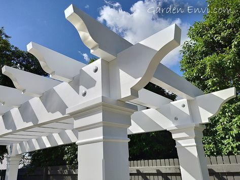 Wow!  This White Pine Hampton's Style Pergola Arbour turned out even better than expected!  It's striking features include a thicker Pine beam and rafter which emanate a commanding presence at the end of the pool.   The large posts with hand made corbels and architrave boxes match the house providing a fluency in design throughout the residence and outdoor structure.   See more pictures and design aspects at gardenenvi.com and make sure you call us to build your next Pergola Arbour! Hamptons Pergola, Pergola With Clear Roof, Roof Home Design, Timber Garden Sheds, Pergola Design Ideas, Deck Shade, Corner Pergola, Outdoor Drapes, Pool Inspiration