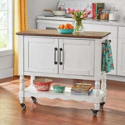 Shop beautiful pieces for... - The Pioneer Woman Magazine White Kitchen Cart, Upholstered Dining Bench, Woman Magazine, Floral Chair, Rolling Kitchen Island, Built In Cabinet, Two Tone Kitchen, Style Nightstand, Interior Shelves