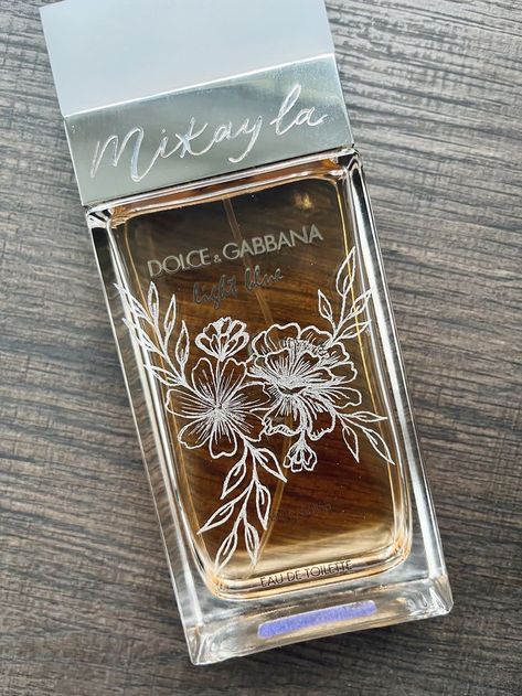 Elevate a gift with personalized glass engraving. Engraved Perfume, Custom Champagne Bottle, Calligraphy Writing Styles, Diy Calligraphy, Dremel Projects, Glass Painting Designs, Laser Engraved Ideas, Glass Engraving, Wedding Day Gifts