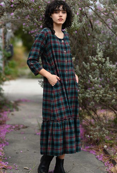 Get cozy and stylish with our Mid Town Dress Flannel! This dress features a button front with shell buttons, side pockets for convenience, and small front darts for a flattering fit. The ruffle hem adds a touch of feminine charm and the dress is perfect for layering over a slip or leggings. Made in the USA for a boho cottage core look! XS Bust 38" S Bust 40" M Bust 42" L Bust 44" XL Bust 46" 1X Bust 48" Length 48" Boho Cottage Core, Cosplay Clothes, Dresses Winter, Flannel Dress, Boho Cottage, Comfy Dresses, Romantic Dress, Shell Buttons, Getting Cozy