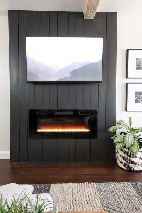 Mantle And Electric Fireplace, Tv On Black Wall Mounted Tv, Large Tv Over Electric Fireplace, Statement Wall With Electric Fireplace, Electric Fireplace Ideas Black, Electric Fireplace Concrete Wall, Electric Fireplace Black Wall, Vertical Shiplap Corner Fireplace, Small Living Room With Electric Fireplace