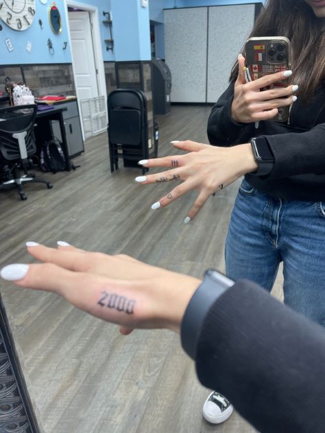 Angel Numbers Hand Tattoo, 2003 Hand Tattoo, Birth Year Finger Tattoo, Birth Year Hand Tattoo, Year Finger Tattoo, Number Hand Tattoos, Hailey Beiber Tattoos, Angel Number Hand Tattoo, Small Tattoos Angel