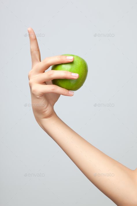 Hand holding apple. by Fisher-Photostudio. A female Caucasian hand holding a whole green apple on grey studio background.#Fisher, #Photostudio, #female, #Hand Hand Holding Apple Reference, Holding Apple Pose, Holding Food Reference, Holding Apple Reference, Hand Holding Something Reference, Hand Reference Holding Object, Hand Holding Apple, Apple In Hand, Hands Holding Something