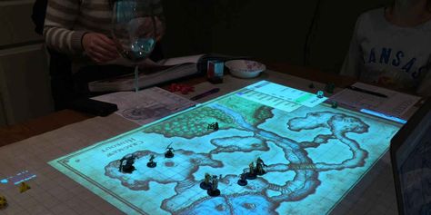 A projector combined with a Web-based tabletop role playing game tool make for a new and really cool way to play Dungeons and Dragons. Dnd Table, Digital Projection, Map Projects, Tabletop Rpg Maps, Pathfinder Rpg, Fun Board Games, Projection Mapping, Dungeon Master, Tabletop Rpg