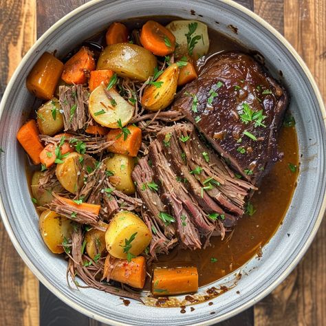 Classic Beef Pot Roast Recipe (Serves 4) This classic beef pot roast is a hearty and comforting dish that's perfect for any occasion. The beef is slow-cooked until it's tender and flavorful, surrounded by a rich gravy and perfectly cooked vegetables. Ingredients For the Pot Roast: 3-4 pounds (1.5-2 kg) beef chuck roast 2 tablespoons olive oil Salt and pepper to taste 1 large onion, chopped 4 cloves garlic, minced 4 large carrots, peeled and cut into chunks 1 pound baby potatoes, halved 3 cu... Pot Roast Aesthetic, Roast Dinner Aesthetic, Pot Roast With Root Vegetables, Roast Beef Potatoes And Carrots, Old School Pot Roast, Beef Pot Roast, Nutritious Smoothies, Beef Chuck Roast, Pot Roast Recipes