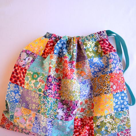 Liberty patchwork drawstring bag | Hello! Hooray! Liberty Fabric Projects, Colorful Patchwork Bags For Daily Use, Square Fabric Patchwork Bag, Patchwork Drawstring Bag, Liberty Fabrics Quilts, Bulk Fabric, Sewing Tutorials Bags, Fabric Shears, Liberty Bag