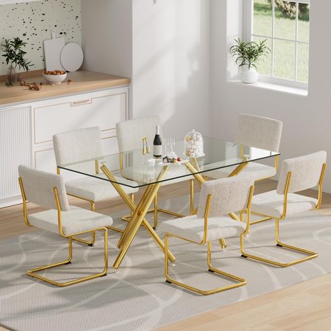 PRICES MAY VARY. Modern 7-Piece Glass Dining Table Chair Set for 6: This 7pcs dining room table set includes 1 dinner table and 6 teddy fabric dinner chairs. This glass dining table set features a shiny frame design that is suitable for any kind of decor style, Ideal for kitchen living room, dining room or small office meeting room. Glass Dinner Table with Gold Metal Legs: The sleek metal legs polished to mirrored effect finish, which create a visually inspiring table that is as much a piece of Long Kitchen Table, Fur Dining Chair, Dining Chairs Luxury, Dining Table Set For 6, Dinner Chairs, Classic Reception, Glass Dining Table Set, Dining Table Gold, Dinner Chair