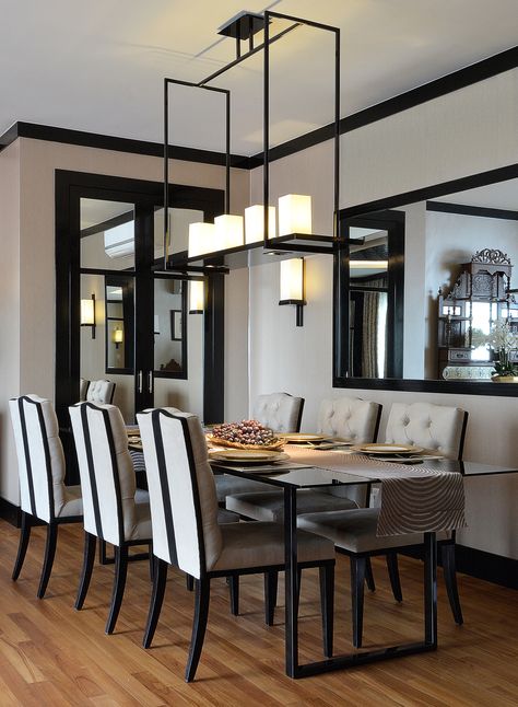 Beige walls with streamlined lacquered black trim. Gloss black dining table & leather dining chairs with backrest detail. The rectangle frame pendant with candles make an elegant focal point. | Design Intervention. Singapore Penthouse.  #tuftedchair #japaneseinspired #asianinspired # eastmeetswest #traychandelier #blacklacquer Beige Wall Black Trim, Black Trim Tan Walls, Black Trim Dining Room, Black Moldings And Trim Living Room, Beige Walls Black Trim, Cream Walls Black Trim, Black And Beige Dining Room, Beige And Black Dining Room, Black Trim Living Room