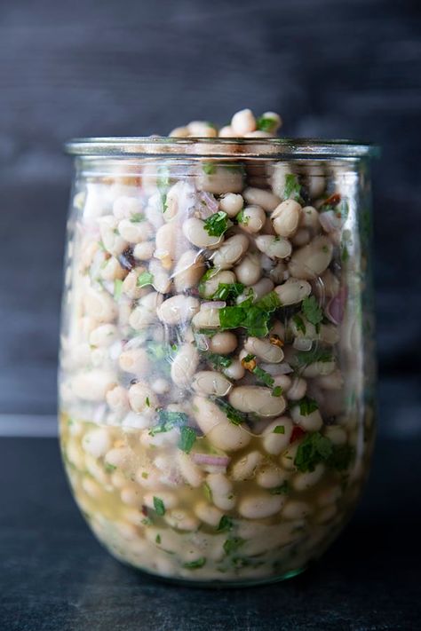 Full of fresh herb flavors, White Bean Salad comes together in a breeze. Made with canned or home cooked white beans, abundant fresh herbs, and a simple vinaigrette dressing, this salad is delicious as a light lunch on its own or as a side dish with all your favorite entrees. White Bean Salad, Simple Vinaigrette, Bean Salad Recipes, One Pot Dinners, Vinaigrette Dressing, Light Lunch, White Bean, Mediterranean Diet Recipes, Bean Salad